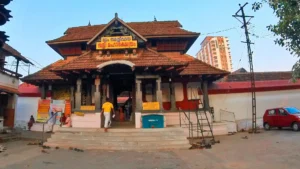 Thali Shiva Temple (Tali Temple) in Kozhikode, Kerala, historic Hindu temple with traditional Kerala-style architecture, wooden carvings, sloping tiled roofs, and cultural significance, surrounded by temple courtyards and greenery.